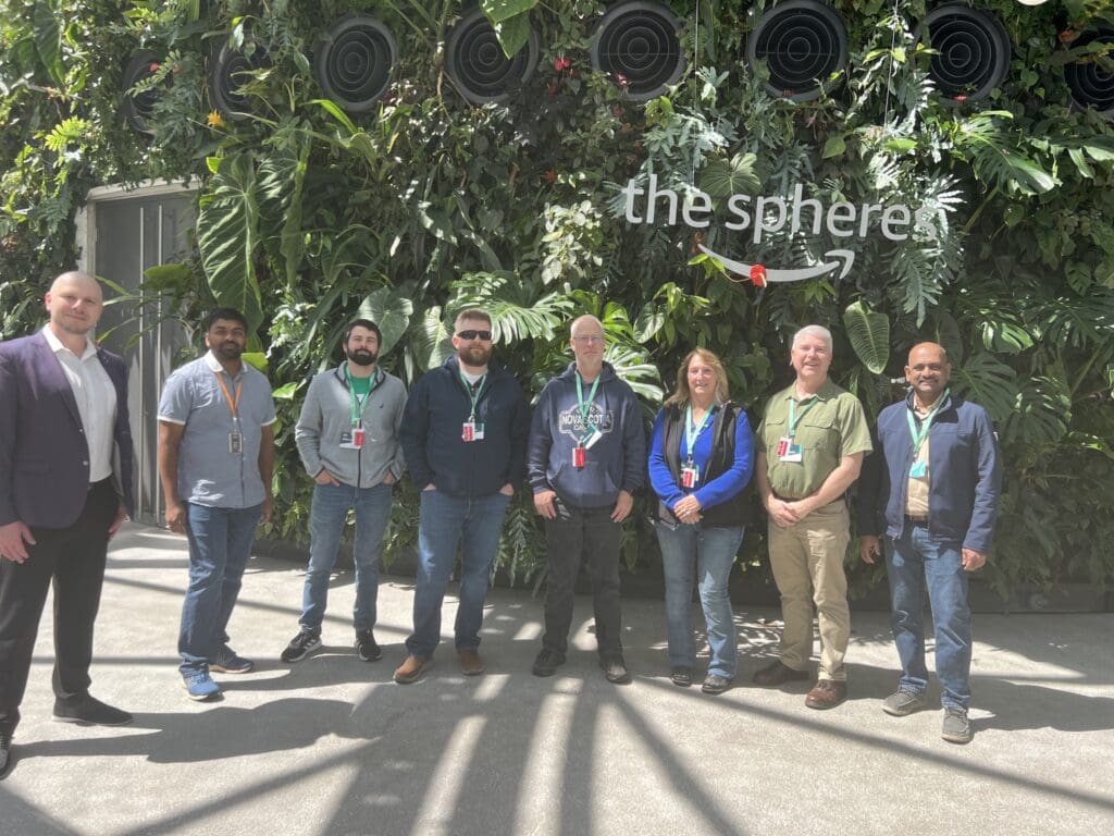 Group of attendees posing at the top of The Spheres